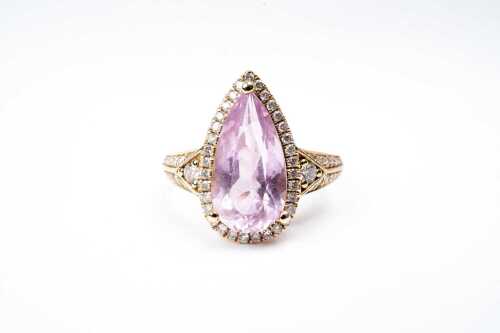 A morganite and diamond ring in 14 carat yellow gold
