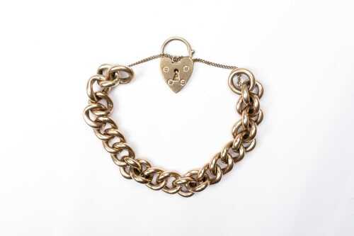 A vintage padlock bracelet in 9 carat yellow gold