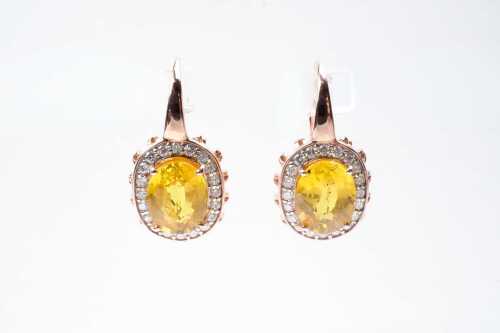 A pair of yellow sapphire and diamond earrings in 14 carat rose gold
