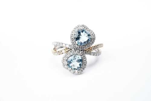 An aquamarine and diamond ring in 14 carat white gold
