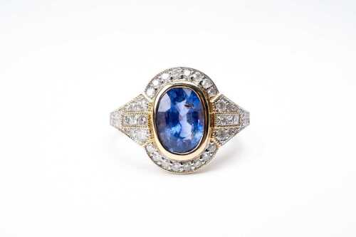 A sapphire and diamond ring in 14 carat yellow gold
