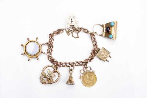 A vintage padlock charm bracelet in 9 carat yellow gold