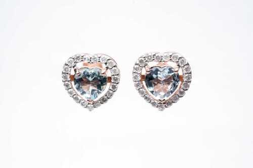 A pair of aquamarine and diamond earrings in 14 carat rose gold