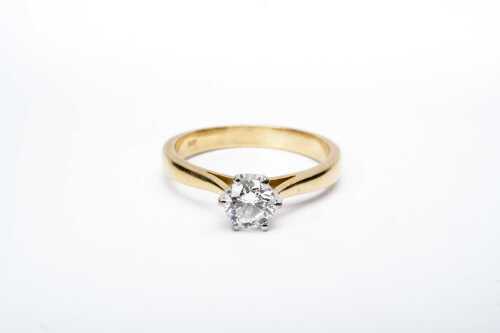 A diamond solitaire ring in 18 carat yellow gold