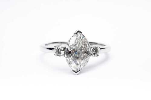 A diamond trilogy ring in 14 carat white gold