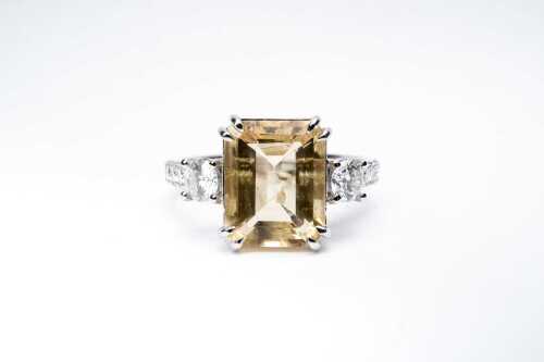 A heliodor and diamond ring in 14 carat white gold
