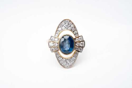 A sapphire and diamond ring in 14 carat yellow gold