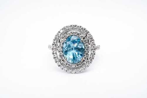 An aquamarine and diamond ring in 14 carat white gold