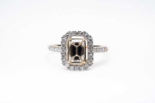 A diamond ring in 14 carat yellow gold