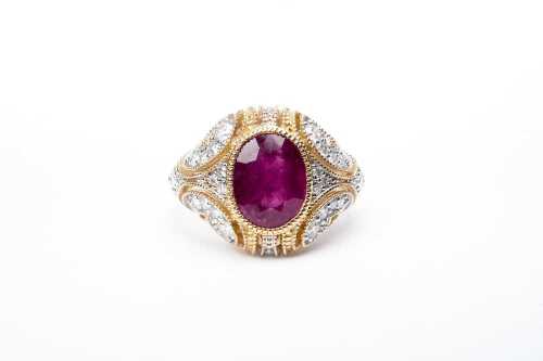 A ruby and diamond ring in 14 carat yellow gold