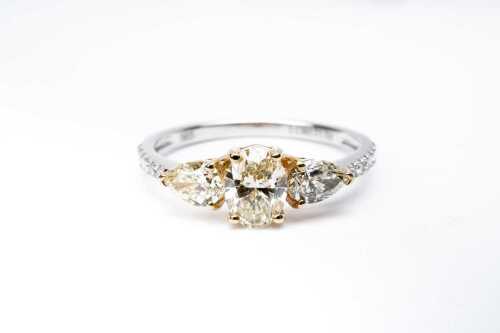 A diamond ring in 14 carat yellow and white gold