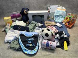 Group of baby boy clothing and accessories