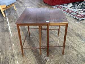 Two mid-century teak nesting side tables
