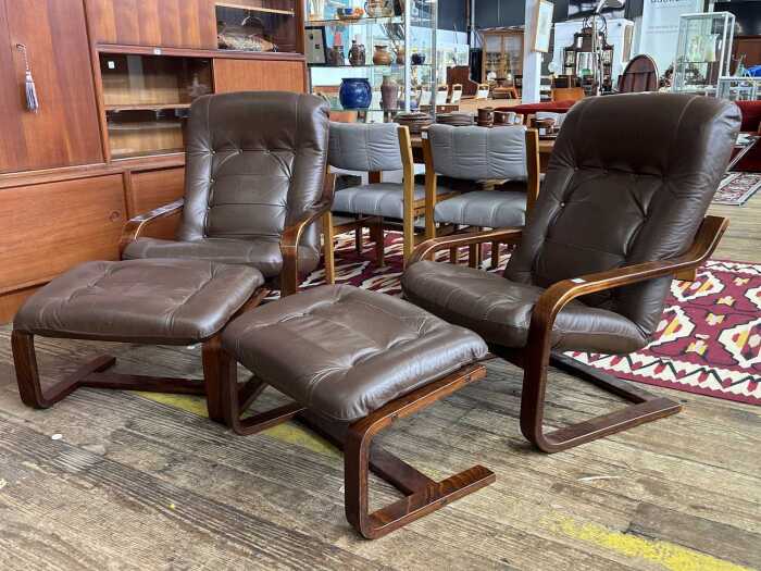 Pair of mid-century armchairs with matching footstools