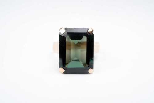 A vintage synthetic green spinel cocktail ring in 9 carat yellow gold