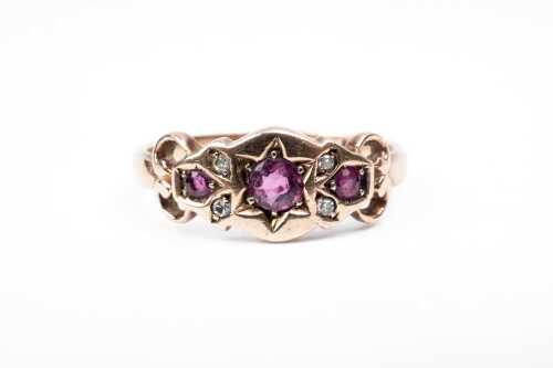 An antique ruby and diamond ring in 9 carat yellow gold