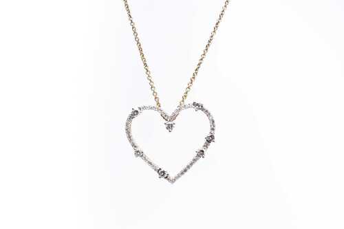 A diamond heart and necklace in 9 carat yellow gold