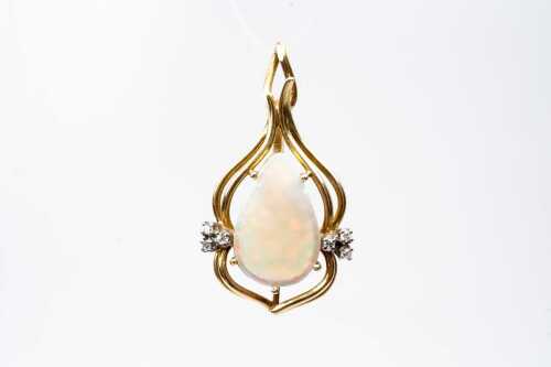 A vintage opal and diamond pendant in 18ct yellow gold