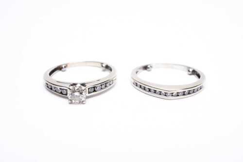 A diamond ring set in 18 carat white gold