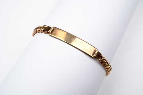 An ID bracelet in 9 carat yellow gold