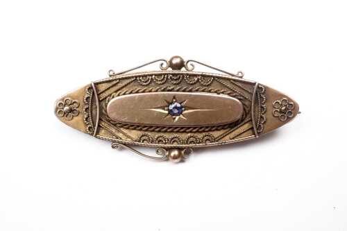 An antique iolite mourning brooch in 9 carat yellow gold