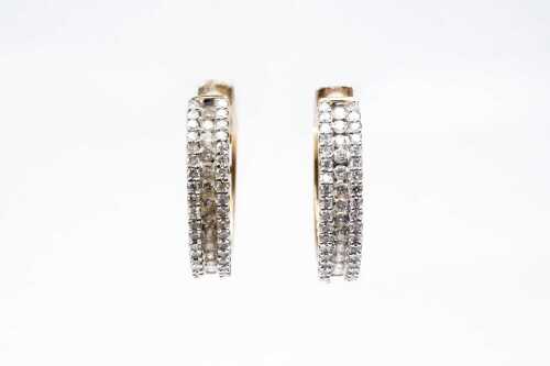 A pair of diamond hoop earrings in 9 carat yellow gold