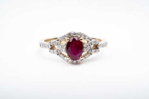 A ruby and diamond ring in 9 carat yellow gold