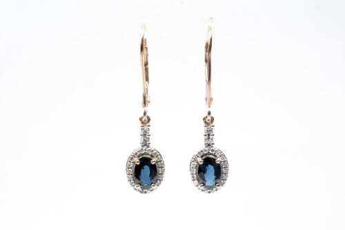 A pair of sapphire and diamond earrings in 9 carat yellow gold