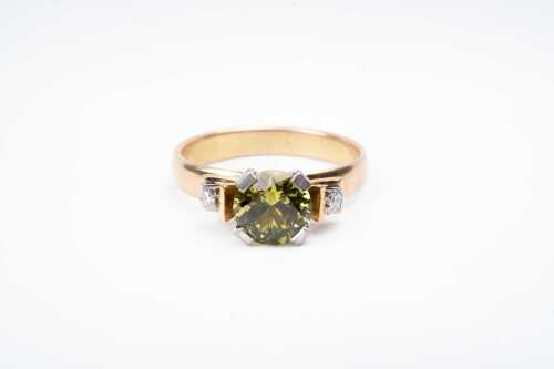 A vintage yellow sapphire and diamond ring in 9 carat yellow gold