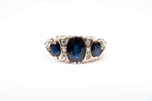 A sapphire and diamond ring in 9 carat yellow gold
