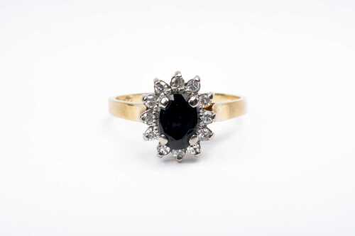 A sapphire and diamond ring in 18 carat yellow gold