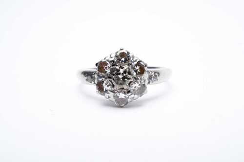 A vintage diamond cluster ring in 18 carat white gold