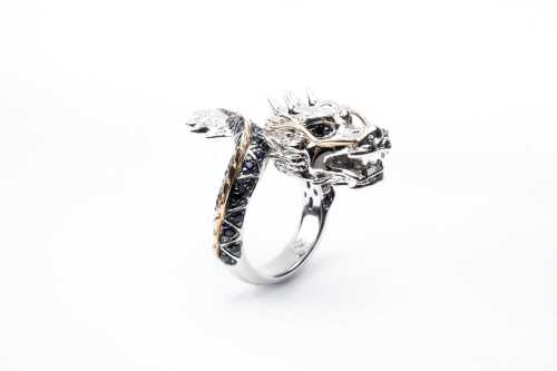 An Effy brand sapphire dragon ring in sterling silver and 14 carat yellow gold