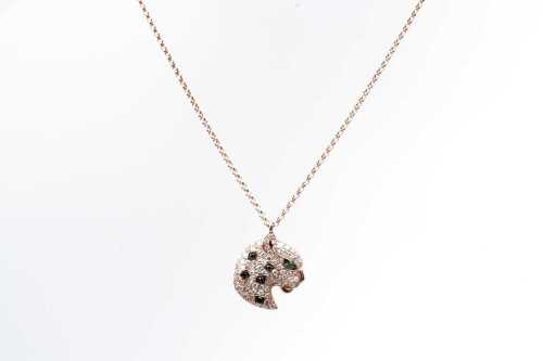 An Effy brand diamond and tsavorite garnet panther necklace in 14 carat rose gold