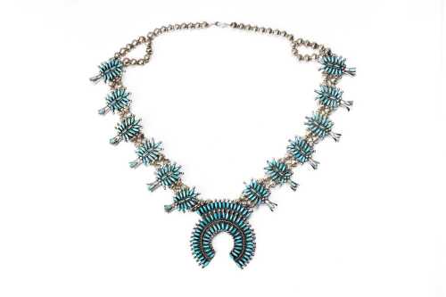 A native American style squash blossom turquoise necklace in sterling silver