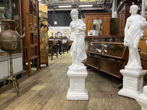Classical style plaster statue of a lady carrying sheaves of wheat