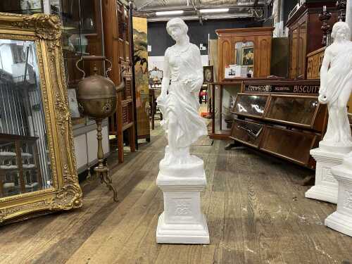 Classical style plaster statue of a lady carrying roses