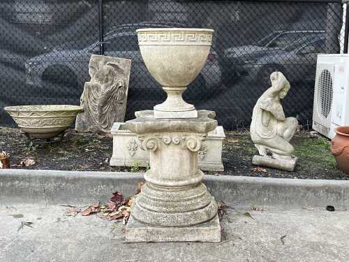 A concrete garden urn and pedestal
