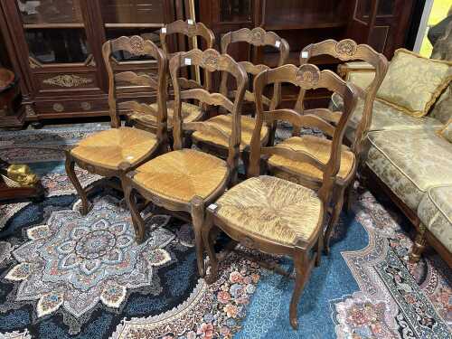 Set of six French provincial oak dining chairs