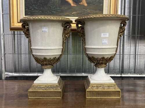 Pair of neoclassical style crackle glaze ceramic urns with cast metal mounts