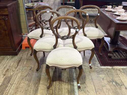 Set of six Victorian walnut balloon back chairs
