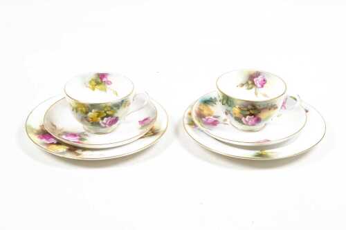 Two antique Royal Worcester hand painted porcelain trios