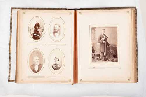 Leatherbound photo album with Melbourne 1883 brass plaque to cover