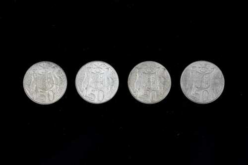 Four 1966 Australian round 50 cent coins