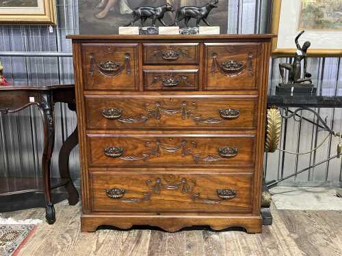 Antique walnut chest of seven drawers