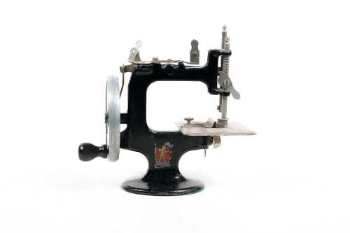 Vintage Peter Pan hand crank miniature sewing machine