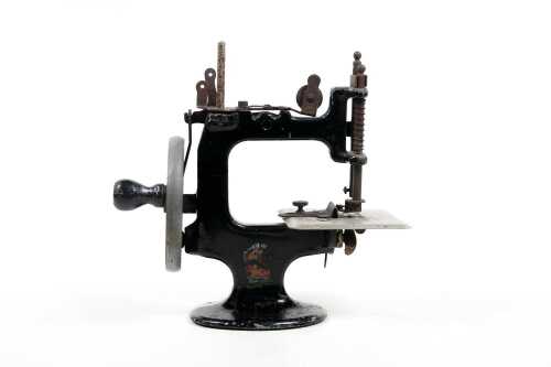 Vintage Peter Pan hand crank miniature sewing machine