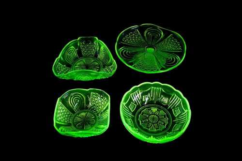 Four Art Deco yellow uranium glass dishes