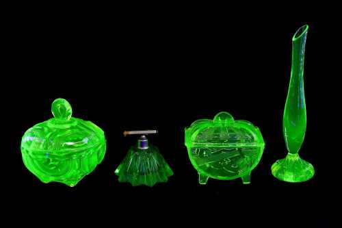 Four uranium glass dressing table items
