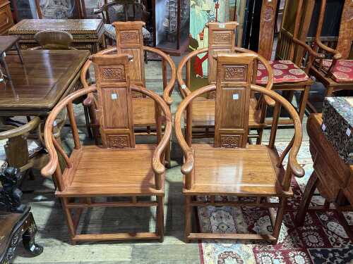Set of four Chinese rosewood horseshoe armchairs
